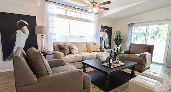 Rexmere Luxury Series living room, beautiful floors and comfortable modern furniture in a light and airy space with very high tray ceiling.