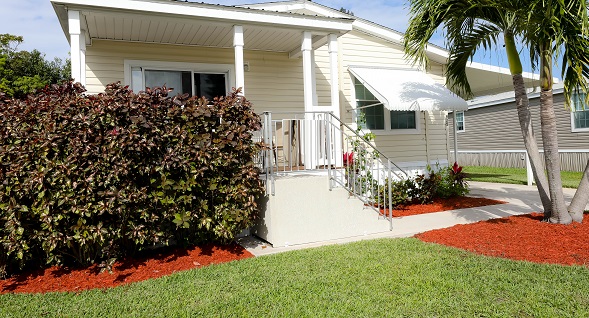 Spectacular curb appeal with extensive landscaping, covered porch and box bay.
