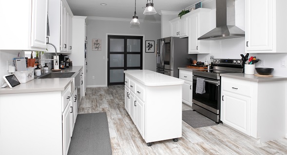 Stylish kitchen with stainless steel appliances and upgraded designer doorways