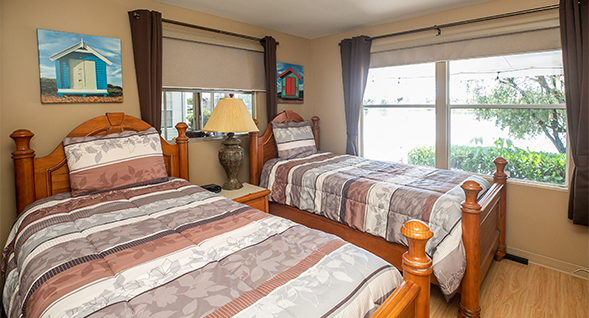 Guest bedroom features lovely views.