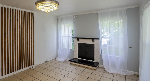Beautiful room with upgraded light fixture, ceramic tile floors and fireplace