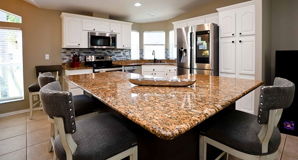 Beautiful open kitchen with granite counters and stainless steel appliances